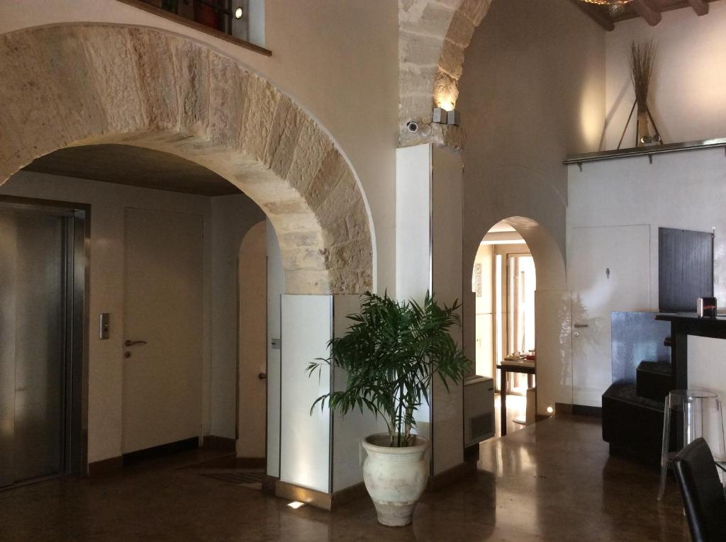 TV a/nebo společenská místnost v ubytování Ucciardhome Hotel