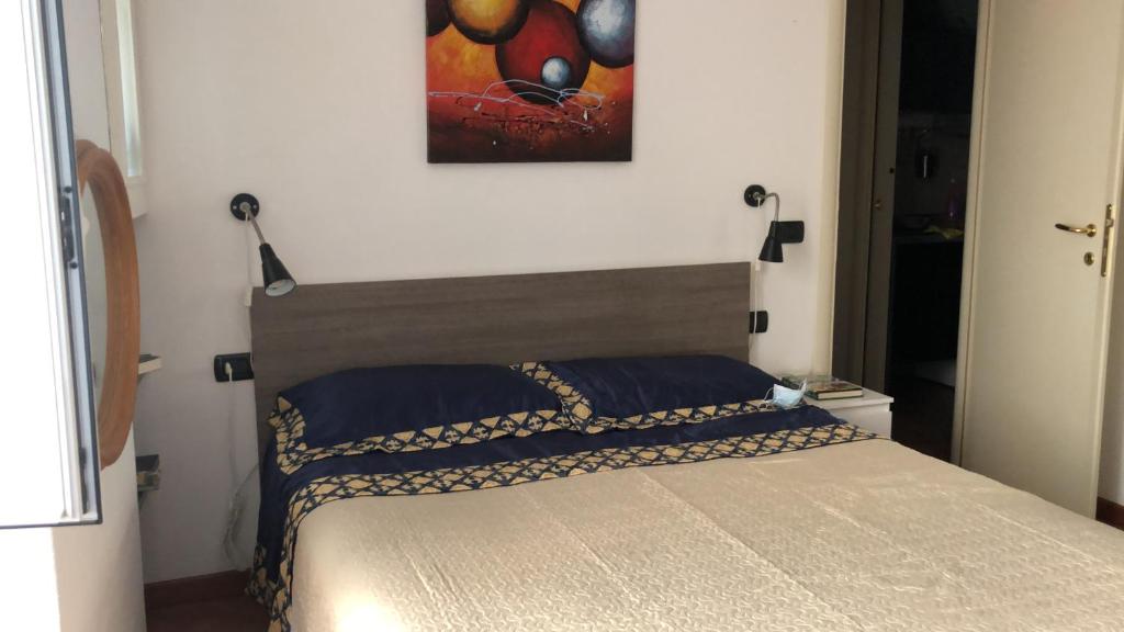 Кровать или кровати в номере Chiavari Centro