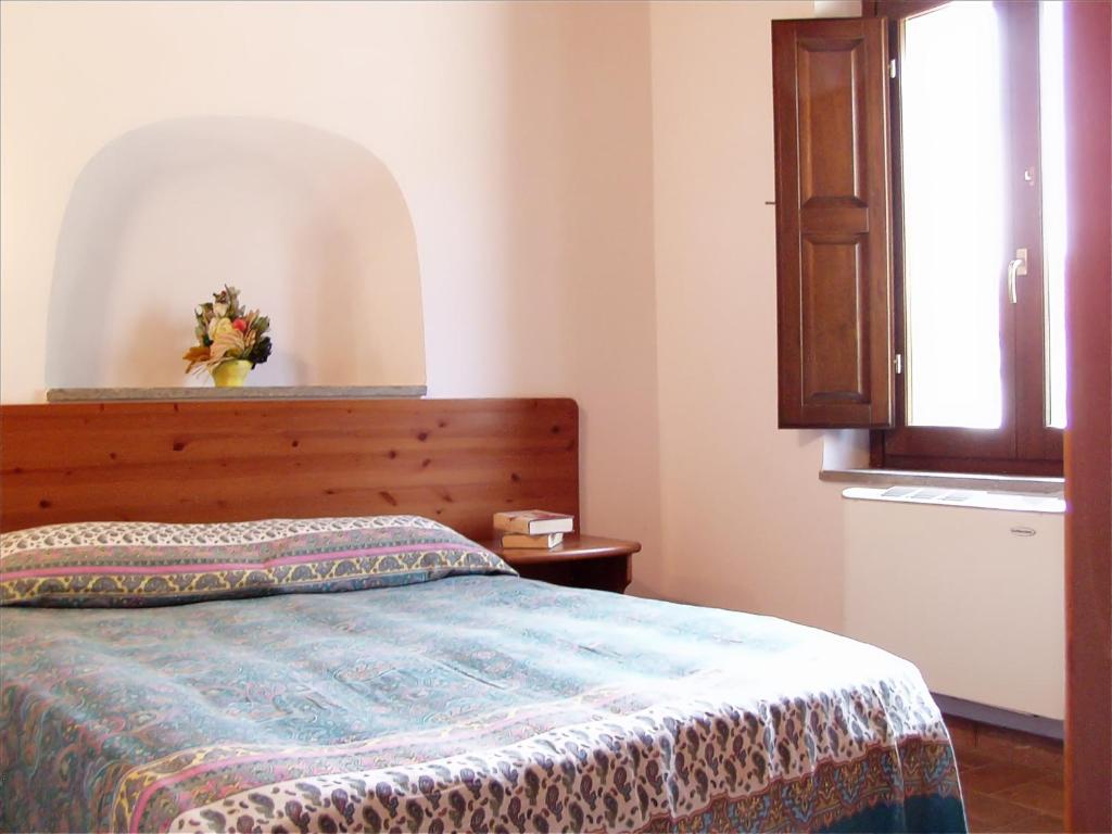 Letto o letti in una camera di Biobagnolese Agriturismo