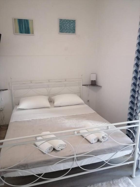 Postel nebo postele na pokoji v ubytování CENTAR NJIVICE