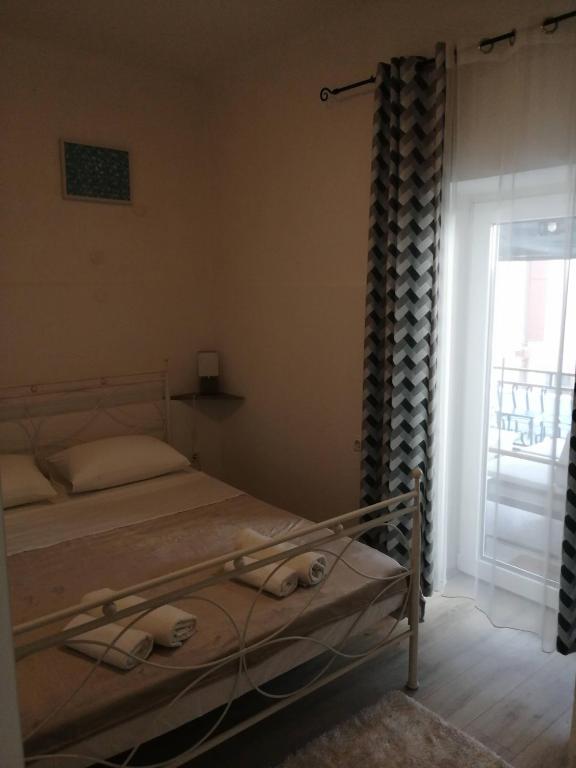 Postel nebo postele na pokoji v ubytování CENTAR NJIVICE