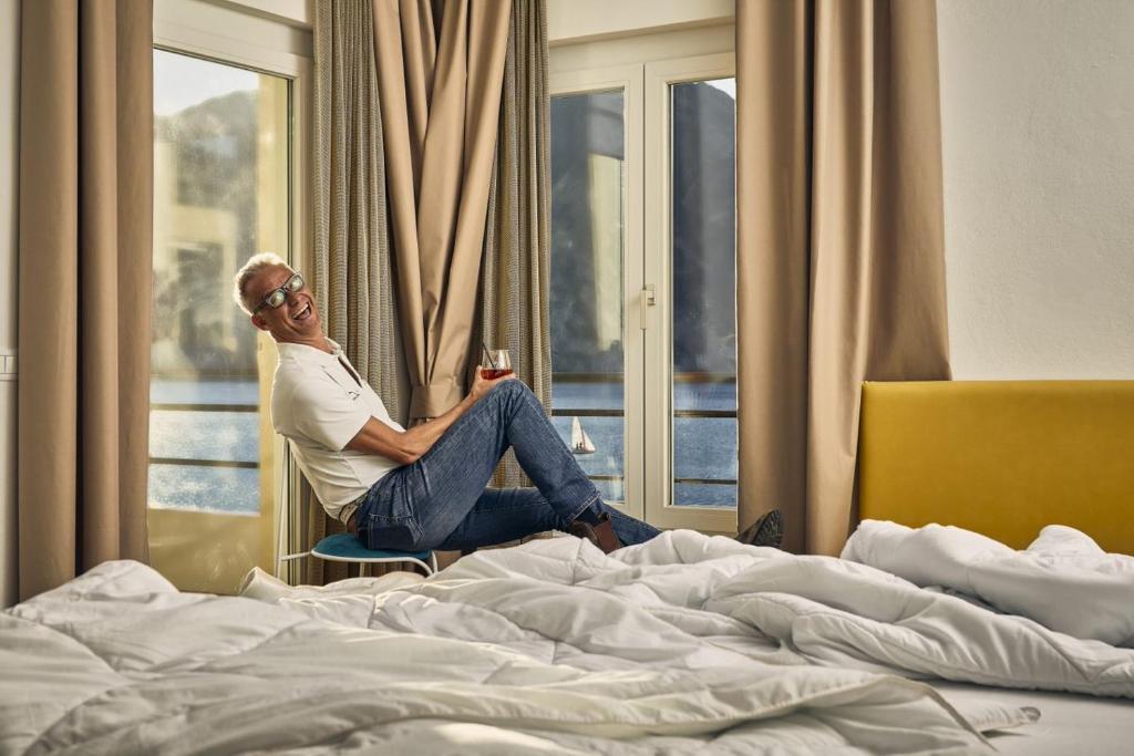 Postel nebo postele na pokoji v ubytování Hotel Paradiso Conca d'Oro