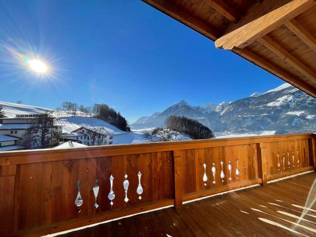 a balcony with a view of a snow covered mountain at Panorama Penthouse mit Sauna & großem Balkon in Gallzein