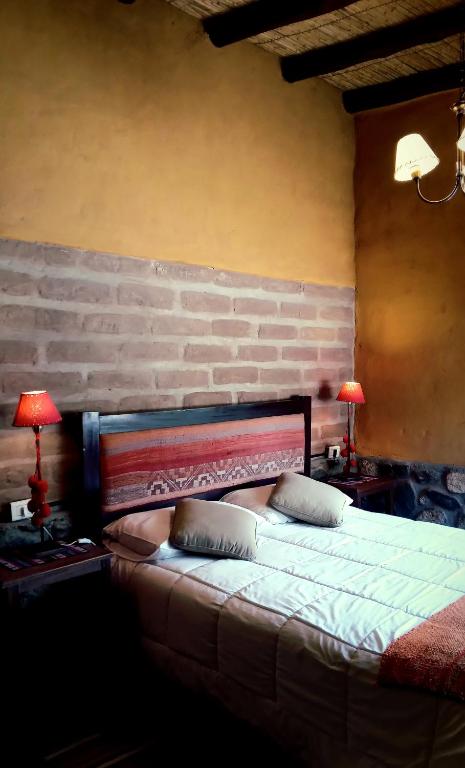 Postel nebo postele na pokoji v ubytování Miraluna Bodega Boutique