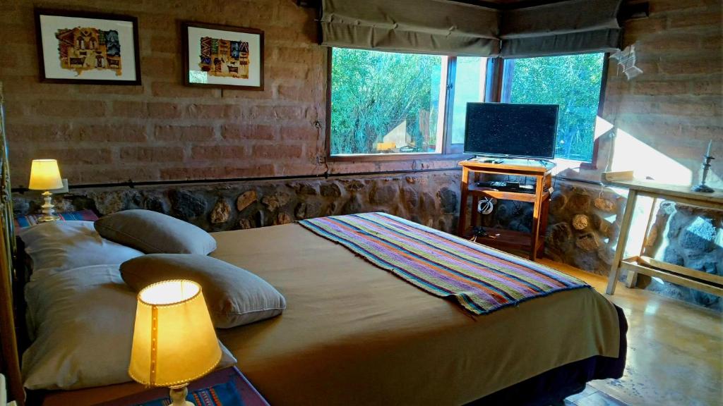 Postel nebo postele na pokoji v ubytování Miraluna Bodega Boutique