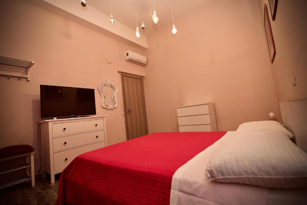 Posteľ alebo postele v izbe v ubytovaní Home Art Colosseo