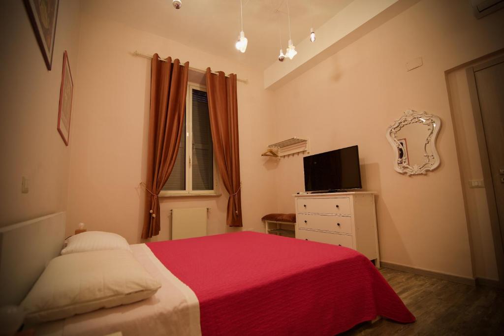 Televízia a/alebo spoločenská miestnosť v ubytovaní Home Art Colosseo