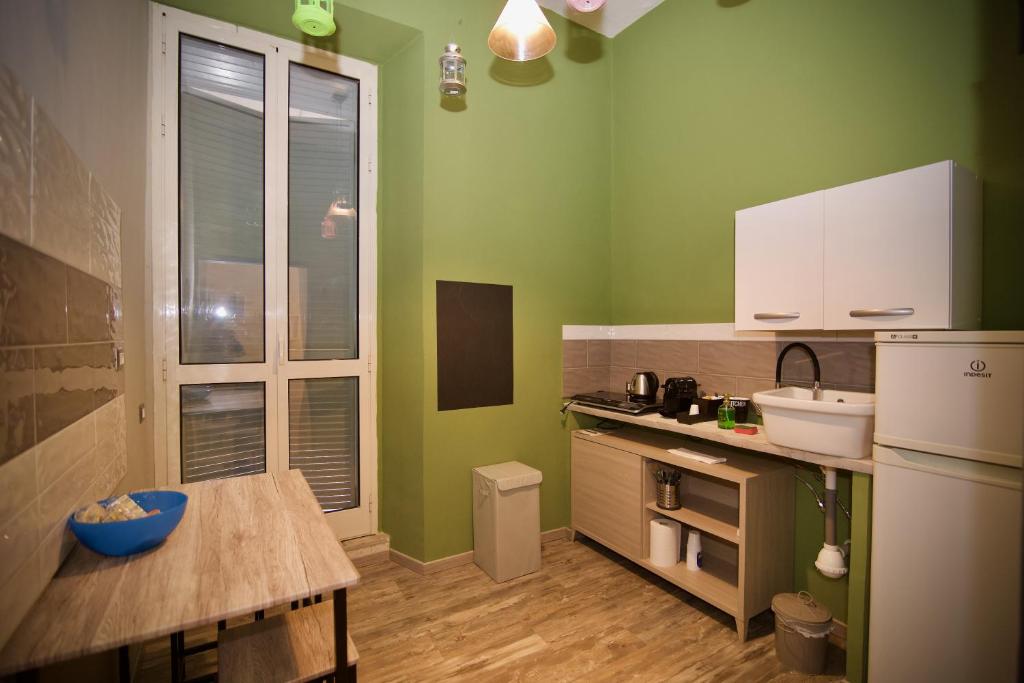 Kuchyňa alebo kuchynka v ubytovaní Home Art Colosseo