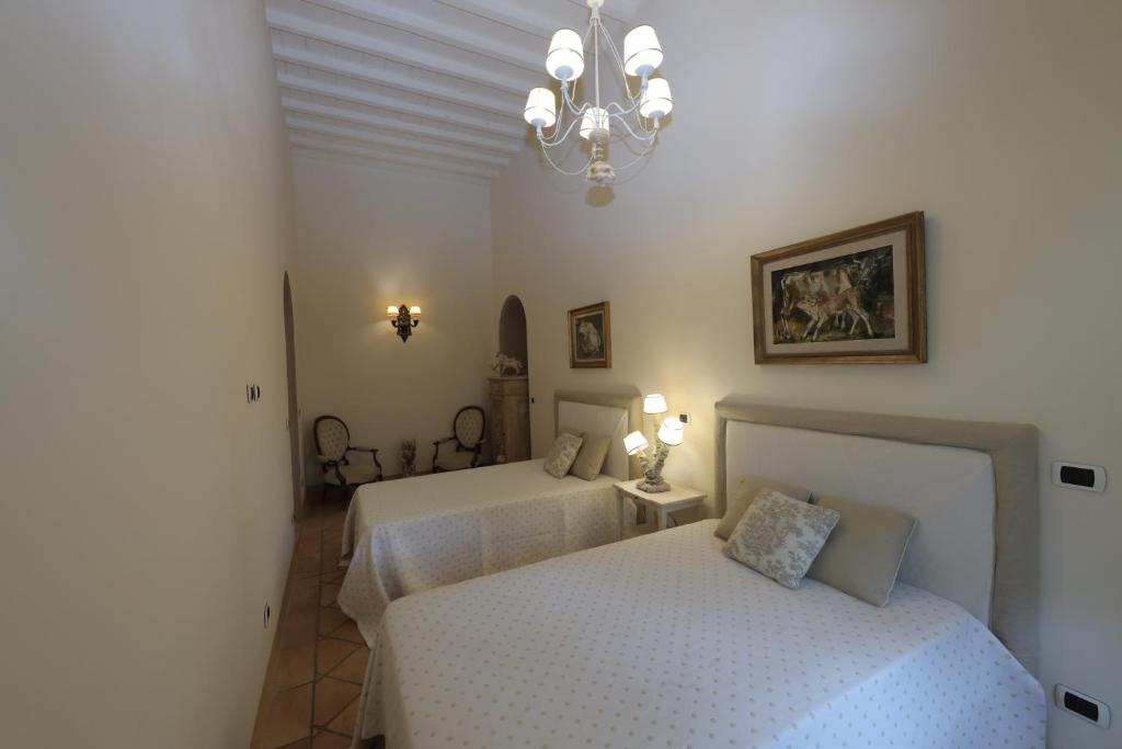 Postel nebo postele na pokoji v ubytování Casa Raiola Ercolano Luxury Rooms & Spa