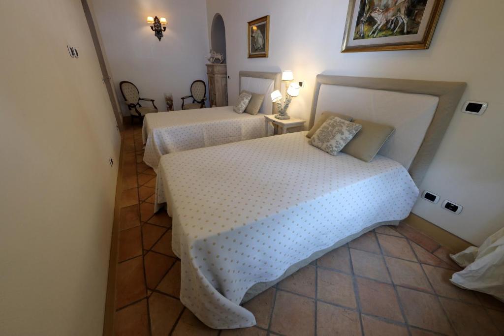 Postel nebo postele na pokoji v ubytování Casa Raiola Ercolano Luxury Rooms & Spa