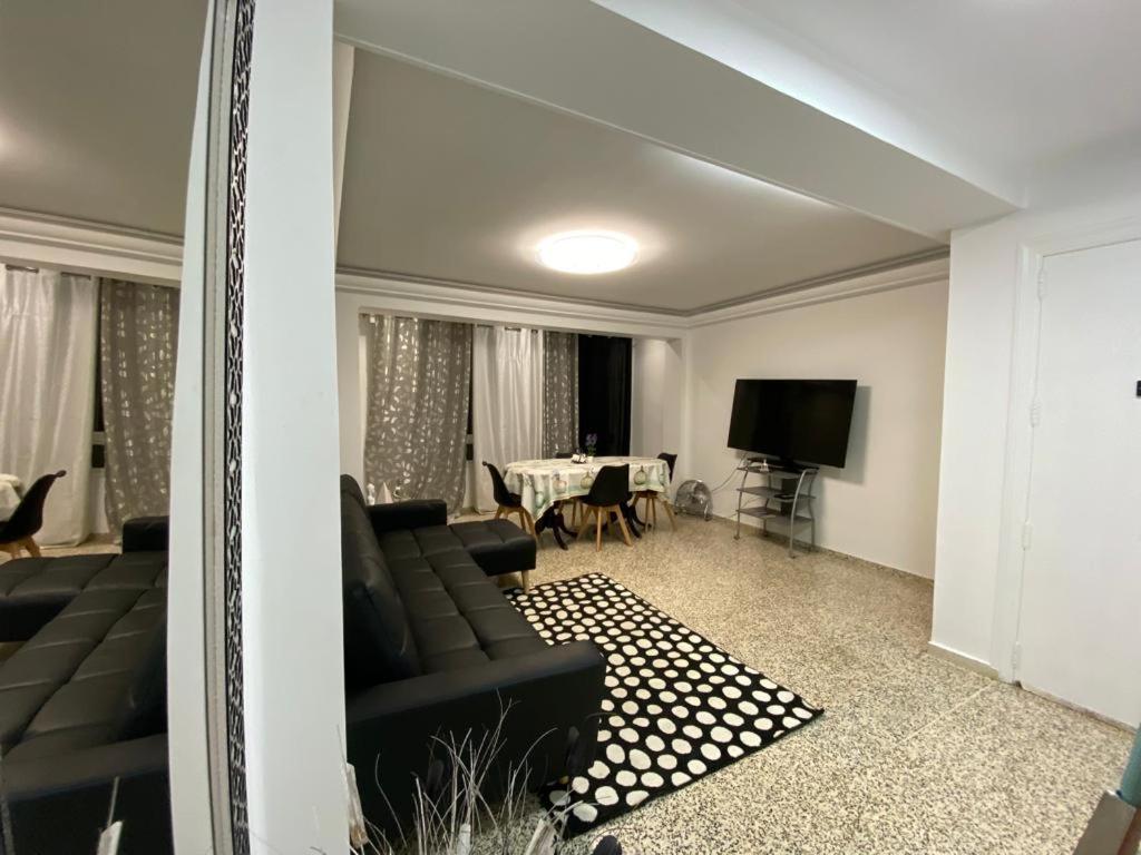 a living room with a couch and a table at Piley apartamento en vila-real in Villareal