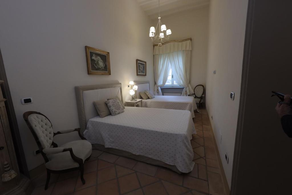 Postel nebo postele na pokoji v ubytování Casa Raiola Ercolano Luxury Rooms & Spa