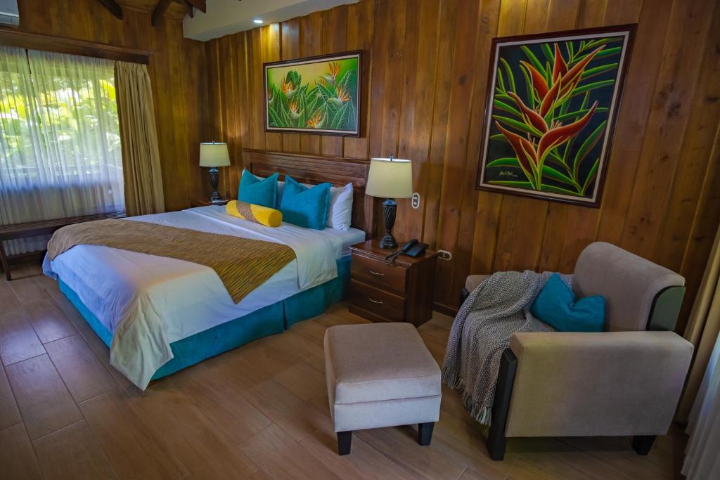 Cama o camas de una habitación en Hotel Lomas del Volcan