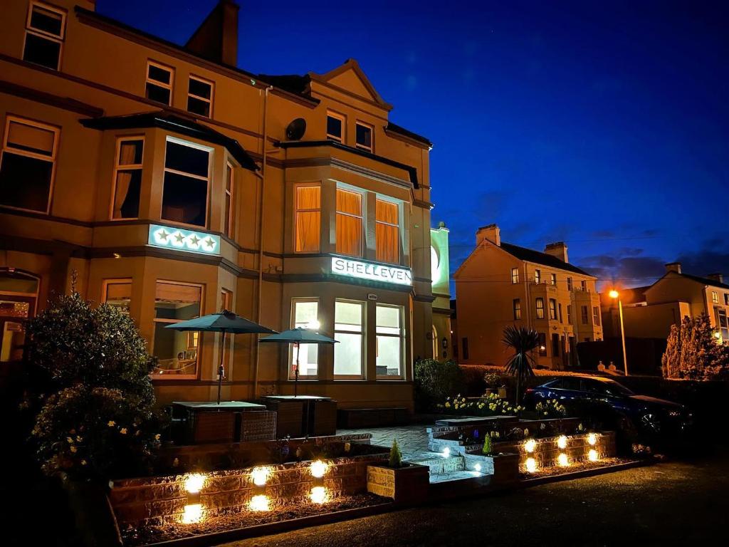 a building with lights in front of it at night at Shelleven Guest House in Bangor