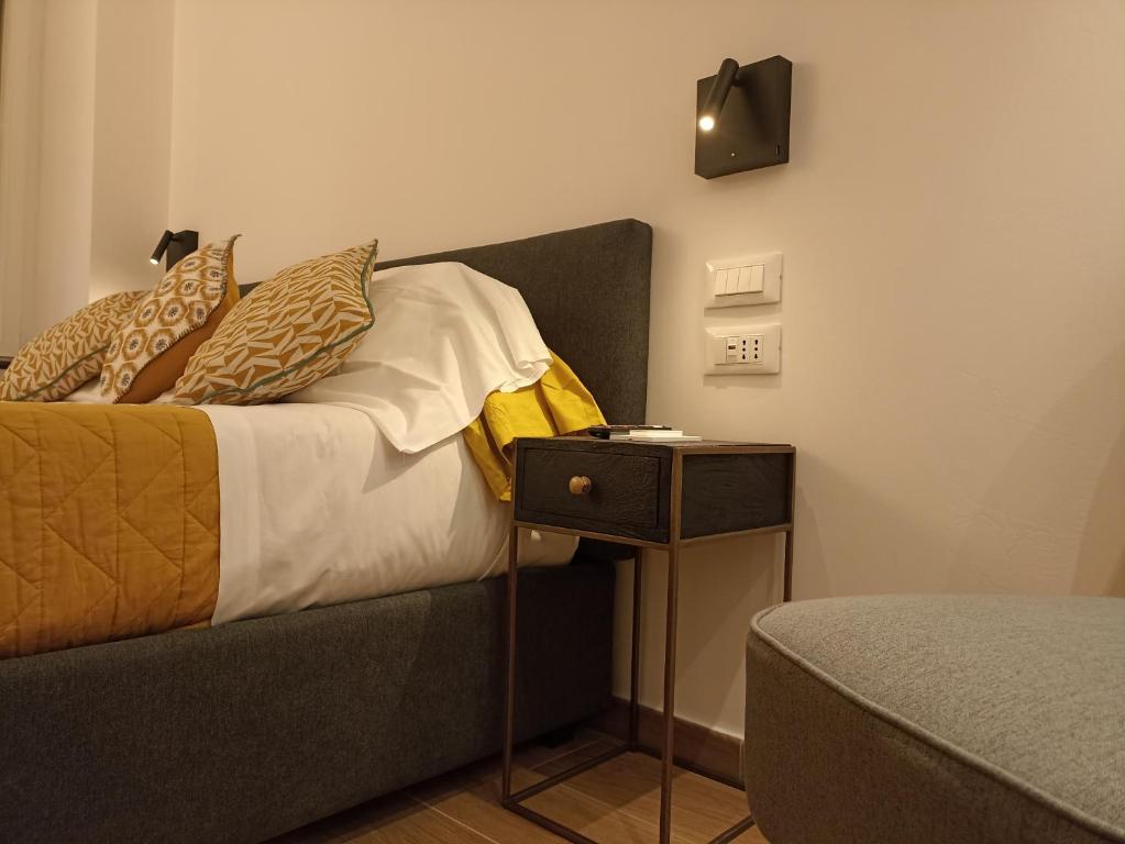 Кровать или кровати в номере Al Porto 61 - Rooms for Rent