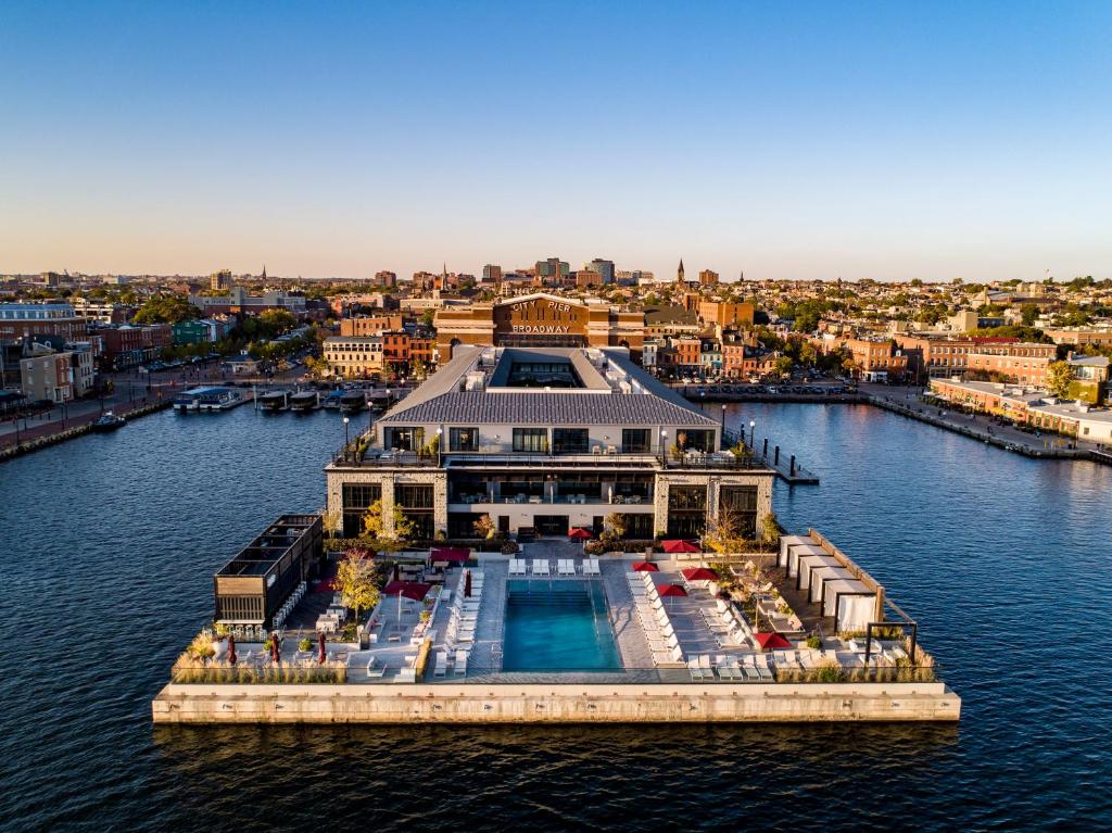 a large boat docked at a dock in a harbor at Sagamore Pendry Baltimore in Baltimore