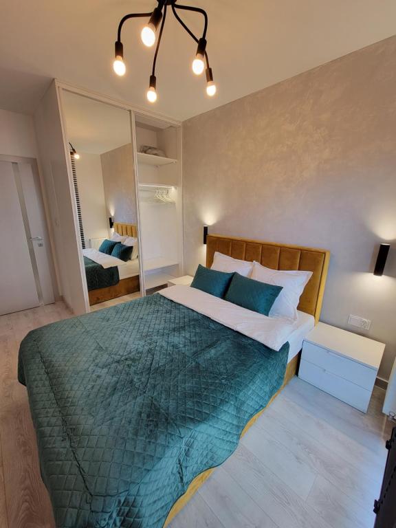 Posteľ alebo postele v izbe v ubytovaní Luksusowy apartament na Starym Miescie