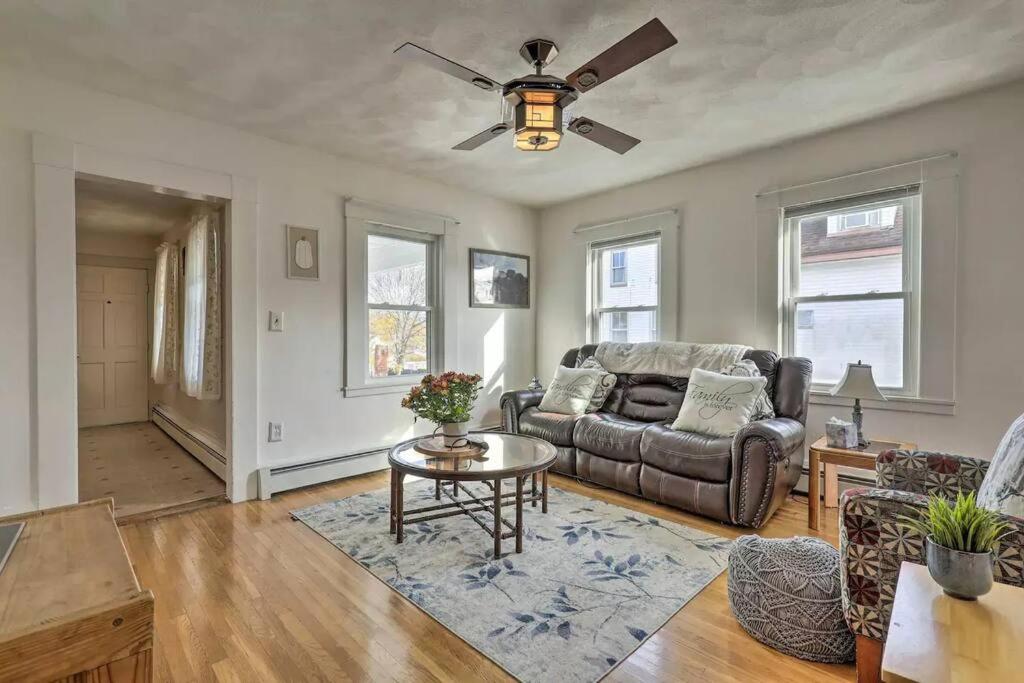 a living room with a couch and a ceiling fan at NEW! Family-Friendly Getaway -1 Mi to Dtwn Salem! in Salem