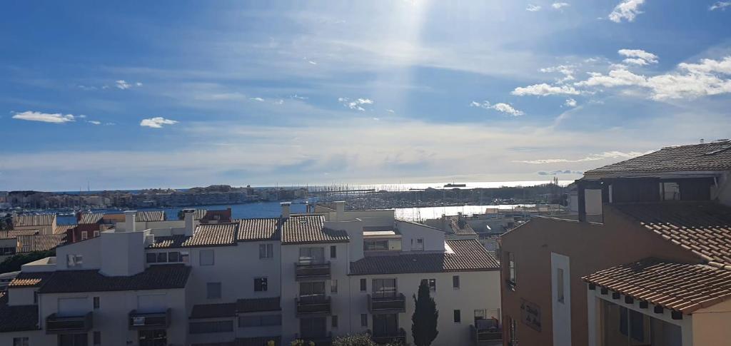 a view of a city with buildings and a body of water at Coquet studio au centre port du Cap d'Agde in Cap d'Agde