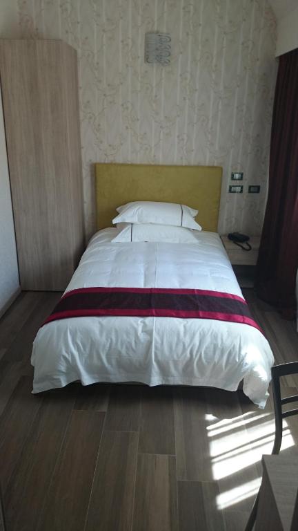 Postel nebo postele na pokoji v ubytování Igiban Hotel