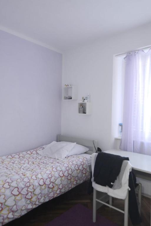 Postel nebo postele na pokoji v ubytování Domagoj