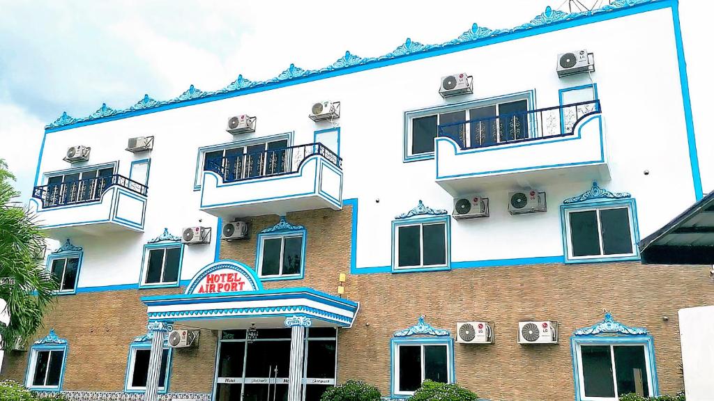 a large building with two balconies on the side of it at Airport Hotel Clark in Angeles