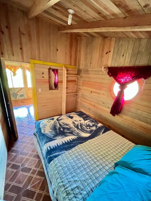 Postel nebo postele na pokoji v ubytování Cabañas los Cedros