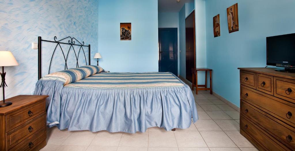 Postel nebo postele na pokoji v ubytování Hotel Atalaya