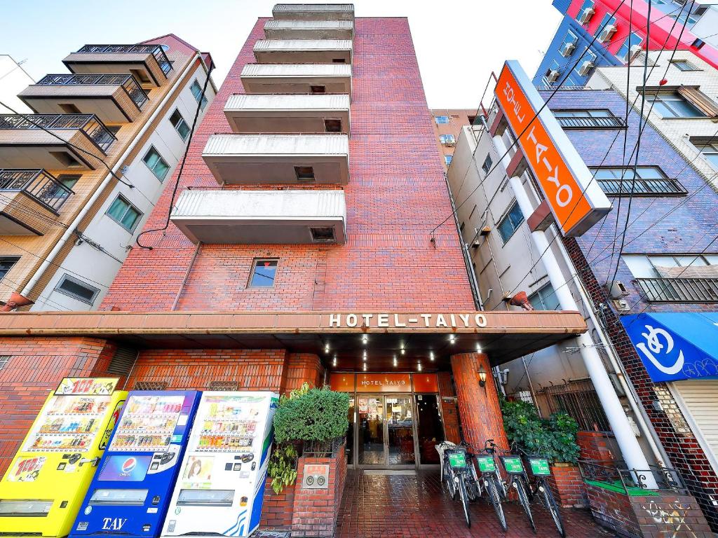 a hotel entry to a building in a city at Business Hotel Taiyo in Osaka