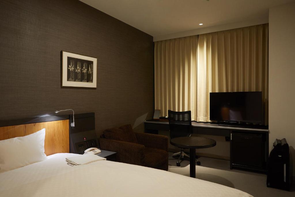 TV a/nebo společenská místnost v ubytování Rhino Hotel Kyoto