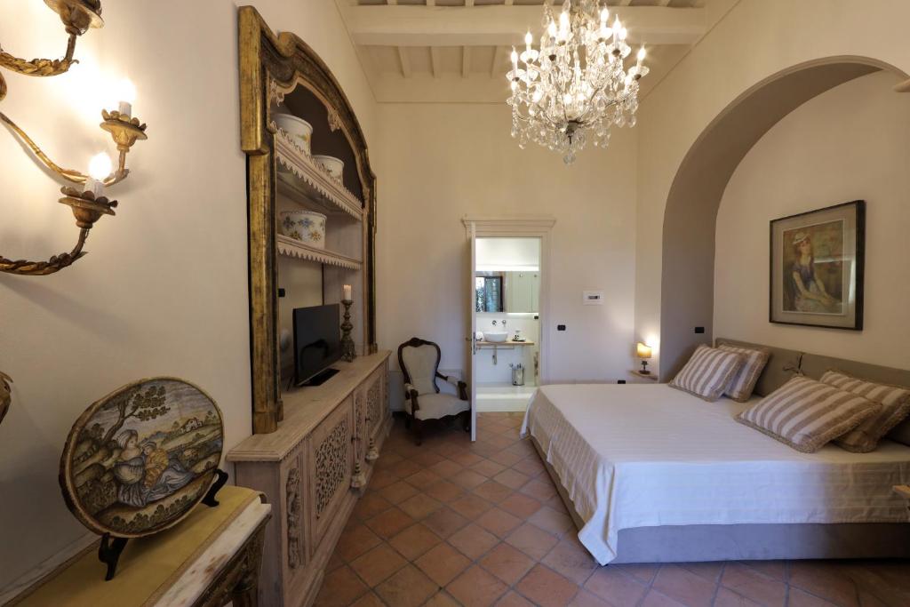 Postel nebo postele na pokoji v ubytování Casa Raiola Ercolano Luxury Rooms & Spa