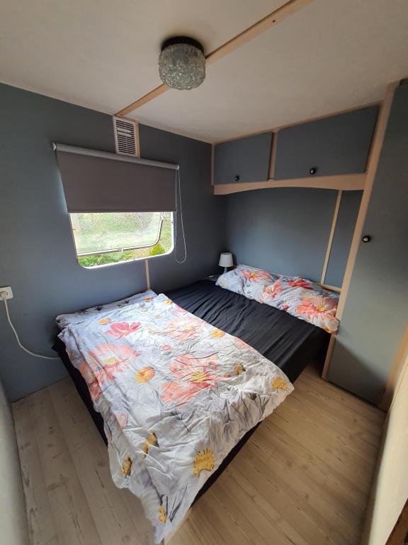 Postel nebo postele na pokoji v ubytování Mobilheim v LVA 1