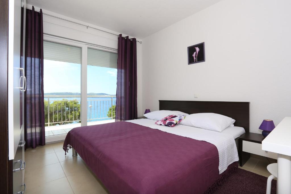 Posteľ alebo postele v izbe v ubytovaní Apartments Dado Trogir