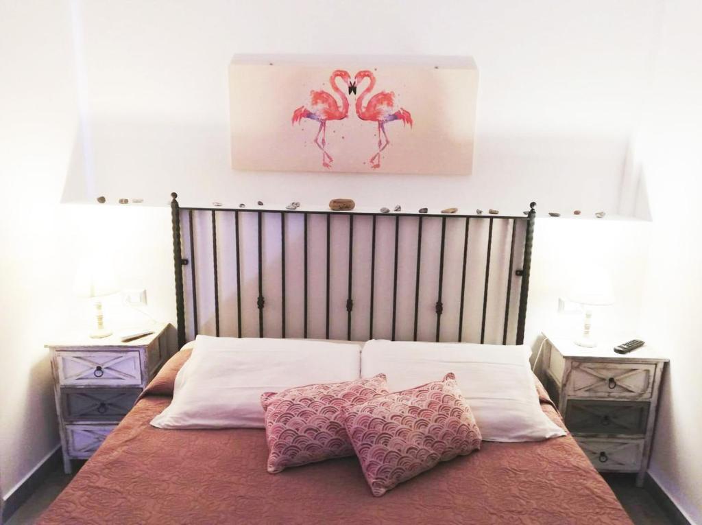 Posteľ alebo postele v izbe v ubytovaní B&B Capo Rizzuto fronte Mare