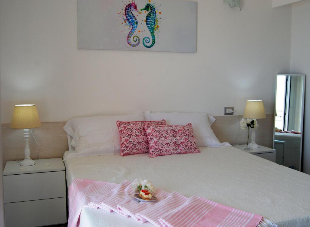 Posteľ alebo postele v izbe v ubytovaní B&B Capo Rizzuto fronte Mare