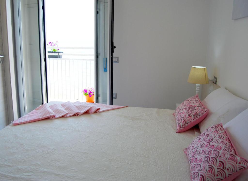 Posteľ alebo postele v izbe v ubytovaní B&B Capo Rizzuto fronte Mare