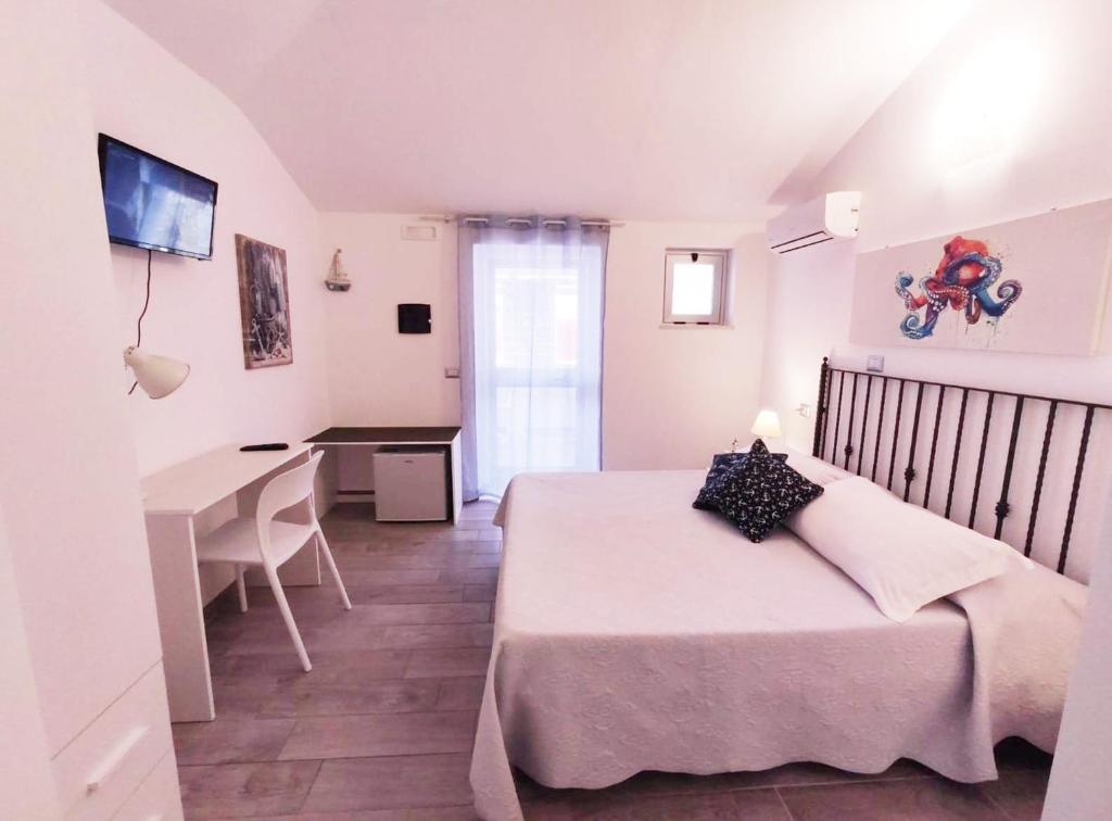 Posteľ alebo postele v izbe v ubytovaní B&B Capo Rizzuto fronte Mare