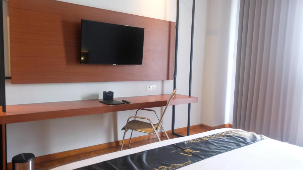 TV a/nebo společenská místnost v ubytování Grand Miami Hotel