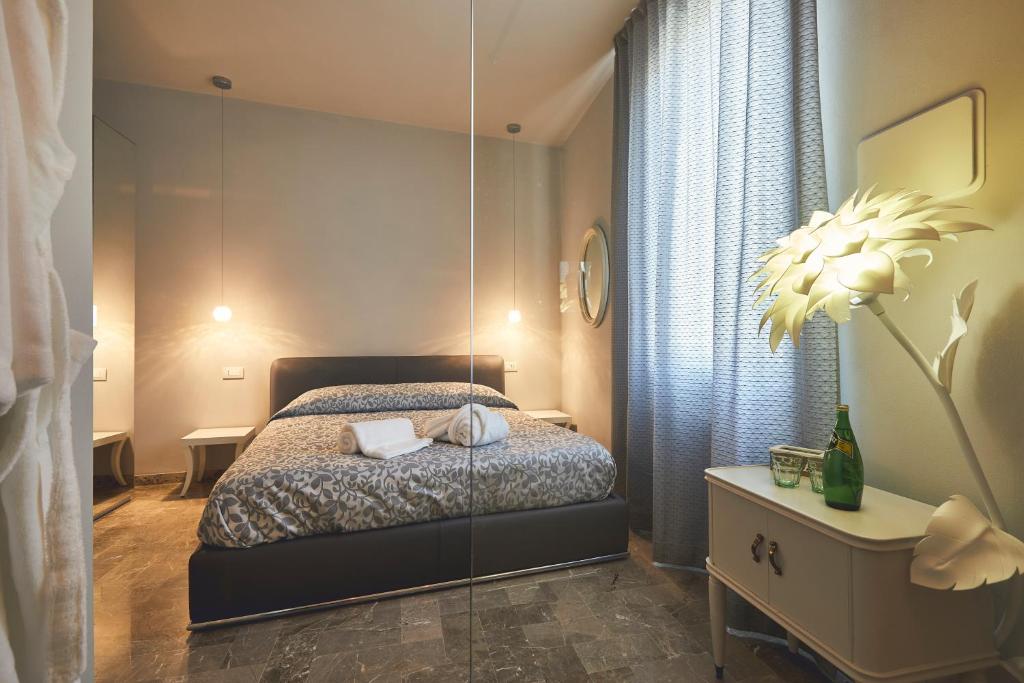 Postel nebo postele na pokoji v ubytování Le Stagioni Luxury Suite