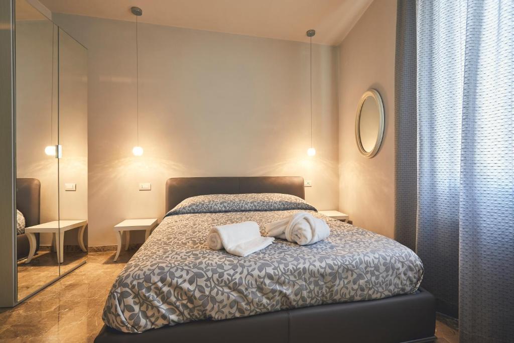 Postel nebo postele na pokoji v ubytování Le Stagioni Luxury Suite
