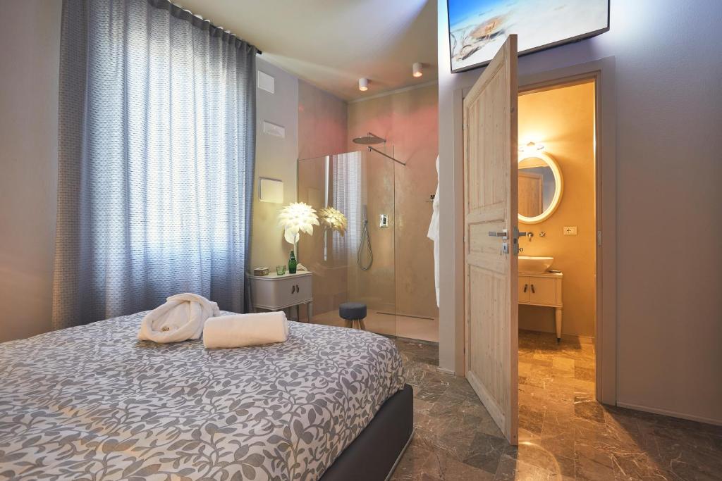 Postel nebo postele na pokoji v ubytování Le Stagioni Luxury Suite