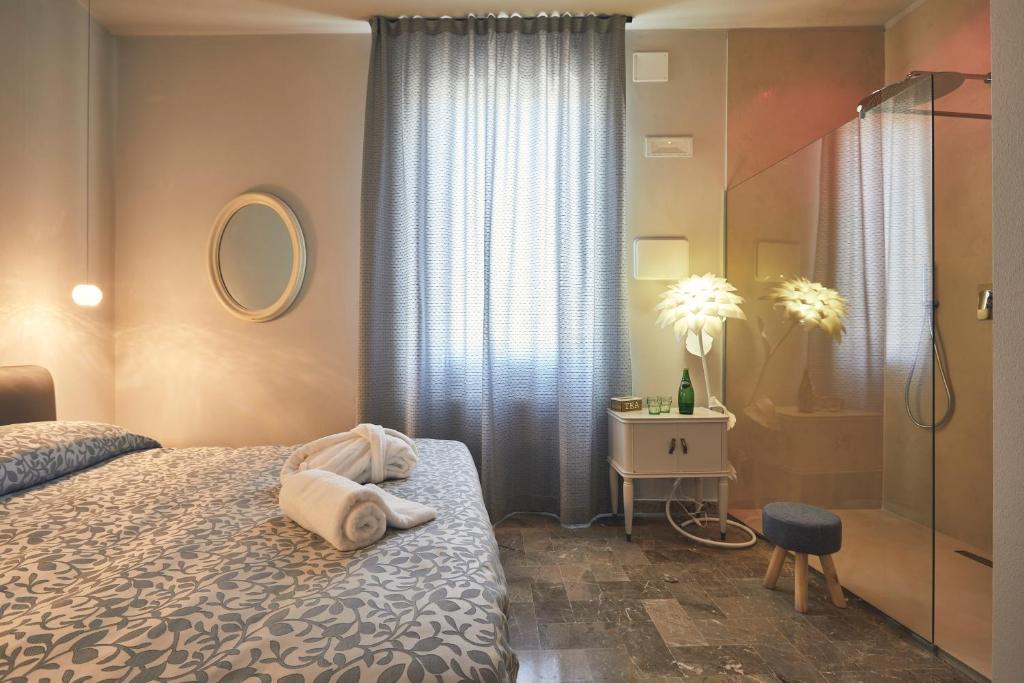 Postel nebo postele na pokoji v ubytování Le Stagioni Luxury Suite