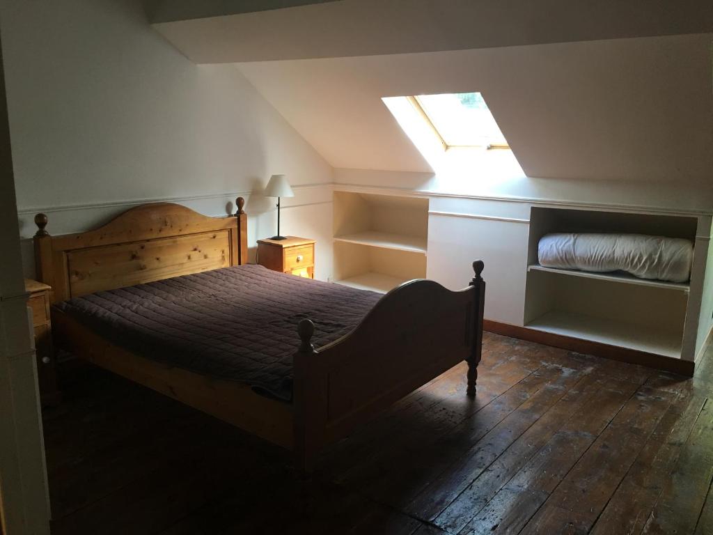 מיטה או מיטות בחדר ב-Gîte Maison des Poules