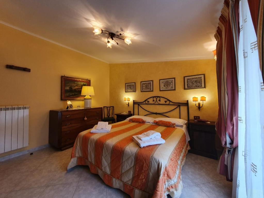 A bed or beds in a room at Residenza Antico Borgo del Pozzo