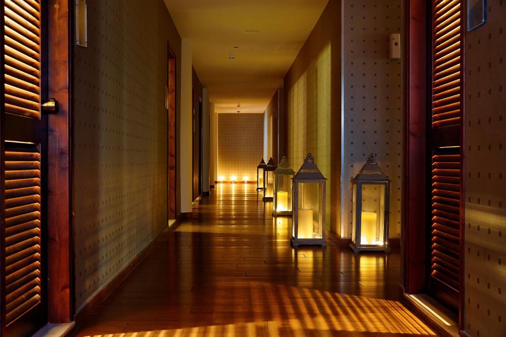 a hallway with lights on the side of a building at Vasia Resort & Spa in Sisi