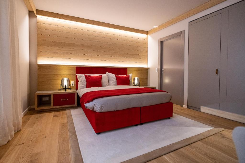 Postel nebo postele na pokoji v ubytování Los Lorentes Apartments Bern City