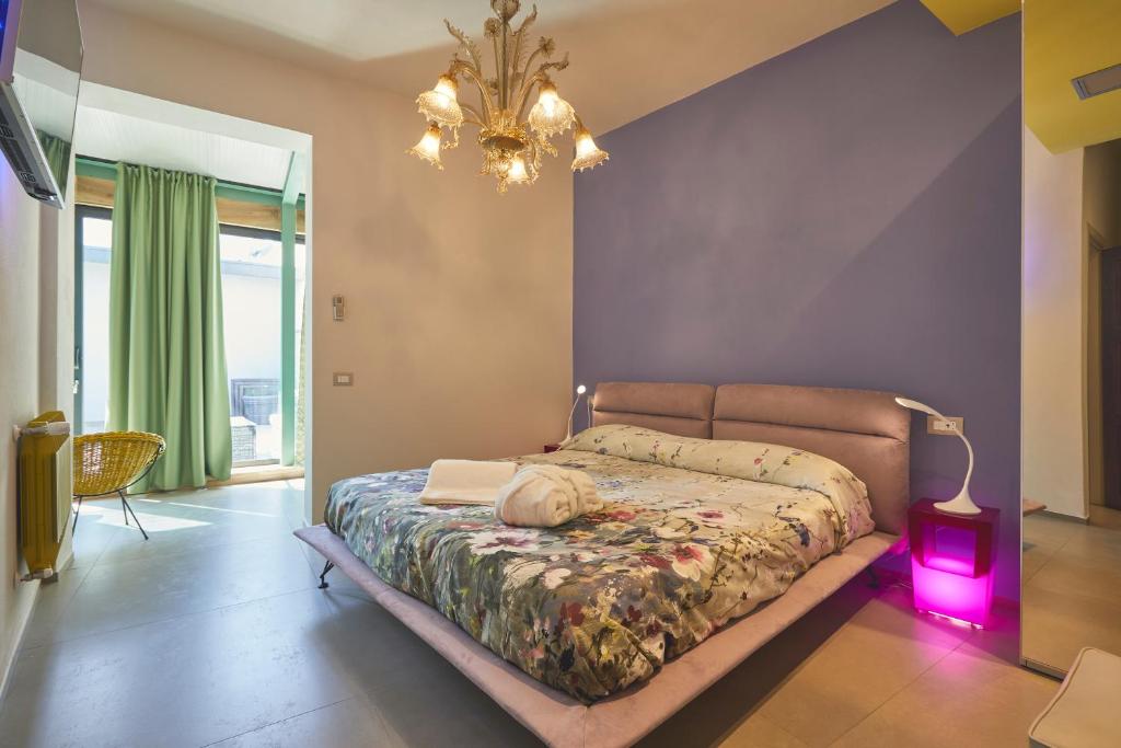 Postel nebo postele na pokoji v ubytování Le Stagioni Luxury Suite