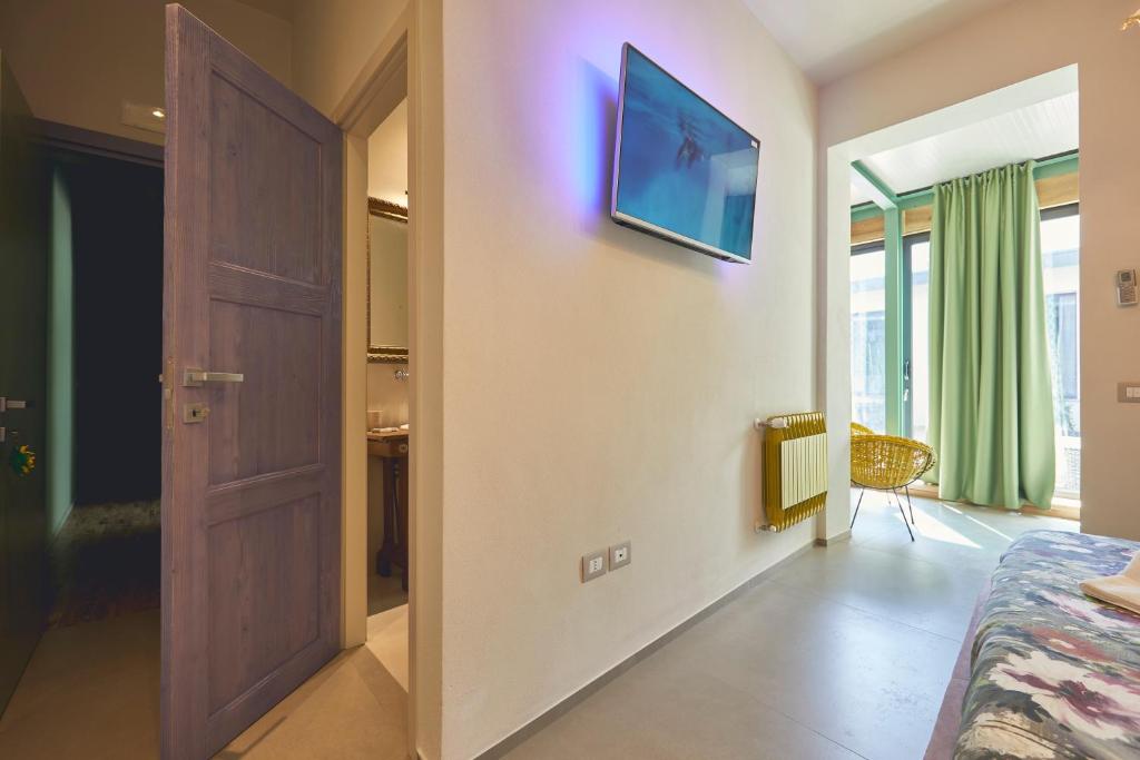 TV a/nebo společenská místnost v ubytování Le Stagioni Luxury Suite