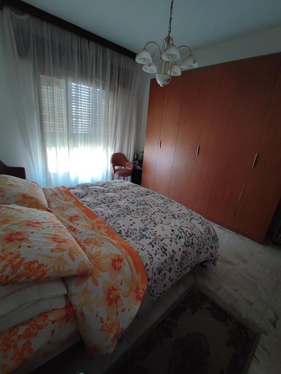 Posteľ alebo postele v izbe v ubytovaní Appartamento Elisa