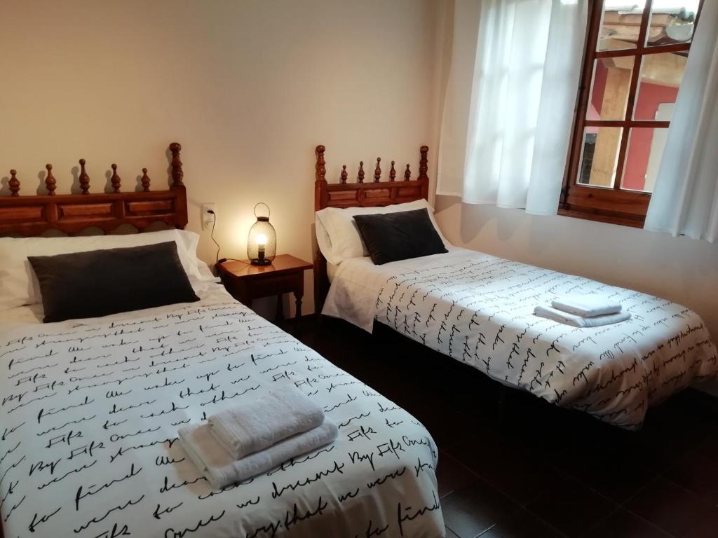 Postel nebo postele na pokoji v ubytování La Casa de les Oques